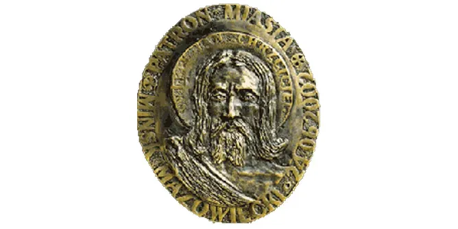 Kliknięcie spowoduje wyświetlenie powiększenia Medalion z wizerunkiem brodatej postaci z długimi włosami otoczony napisem.